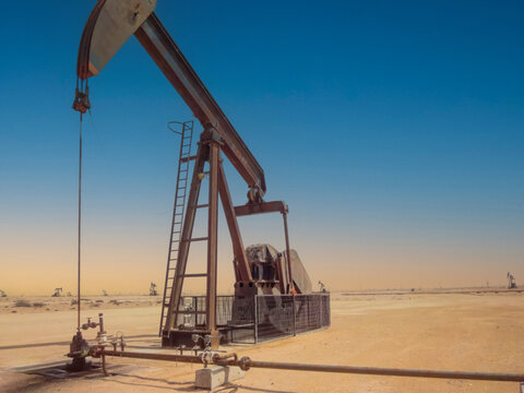 odil pump jack in arabian desert oil field